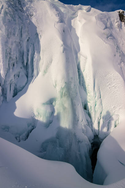 Frozen waterfall on mountain.
