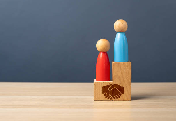 istock Agreement between competing opponents. To make a profitable deal. To be equal with the opponent. Create balanced partnerships. Win-win outcomes. Business and diplomacy 2202102511