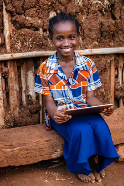 istock African girl using digital tablet, East Africa 2202103401