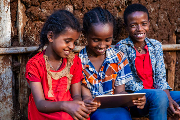 istock African children using digital tablet, East Africa 2202103541