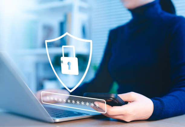 istock Cybersecurity concept. Lock icon and password input. Woman using laptop with shield icon representing cyber security, online security measures, password protection, data privacy, scam, Internet fraud, 2202106050