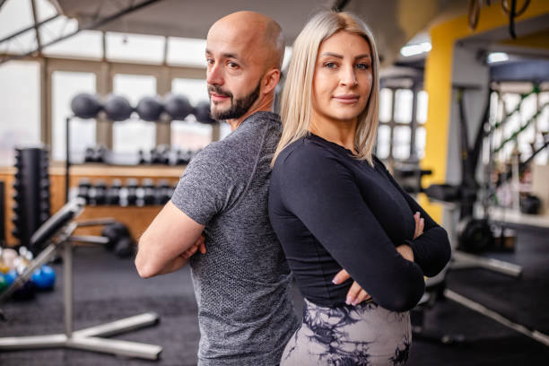 istock Confident Fitness Pair Standing Back to Back 2202107692