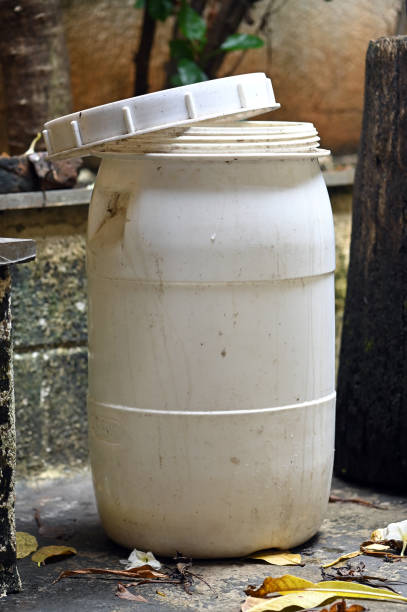 Close-up of oak barrel with metal hoops at the workshop