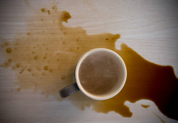 istock glass of coffee spills on the table. 2202112242