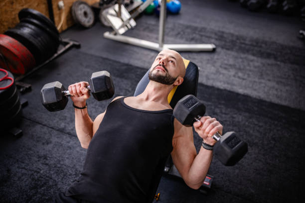istock Engaged Weightlifting Session in Modern Gym 2202112250