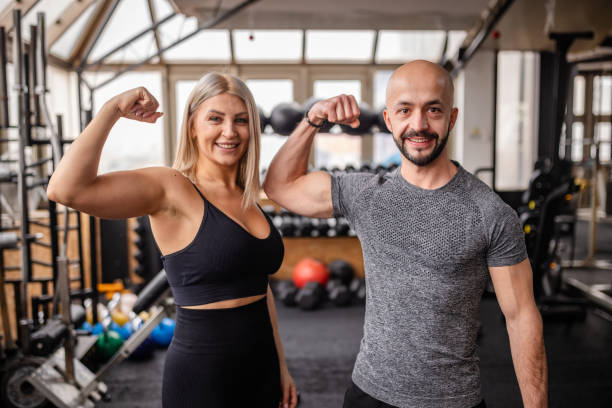 istock Engaging personal trainer with fitness client 2202112329