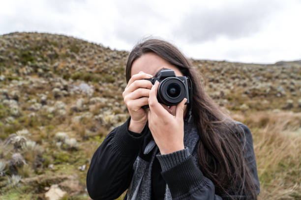 istock Woman Taking a Photo in a Paramo Landscape 2202116476