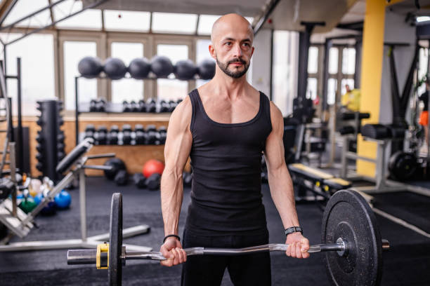 istock Focused Weight Lifter at the Gym Training Hard 2202118076