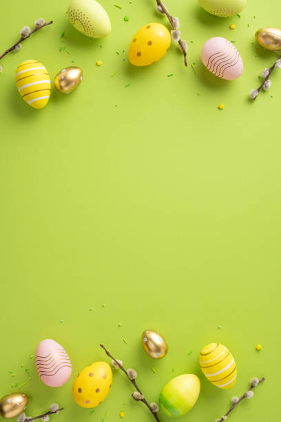 istock Beautiful vertical Easter eggs arranged on a green background surrounded by festive decorations 2202118170