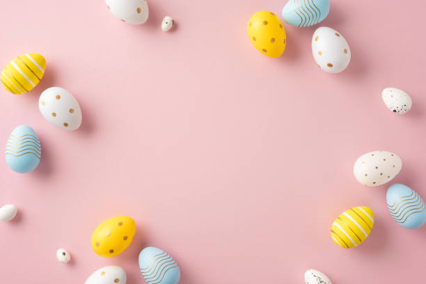 Colorful decorative eggs on pink background, perfect for Easter-themed designs and celebrations