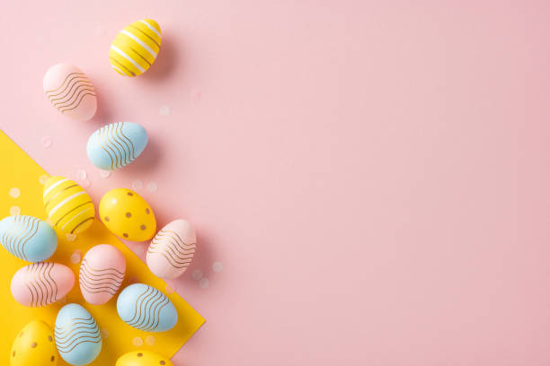istock Colorful decorative Easter eggs arranged on a soft pink background corner, evoking springtime celebrations 2202118188