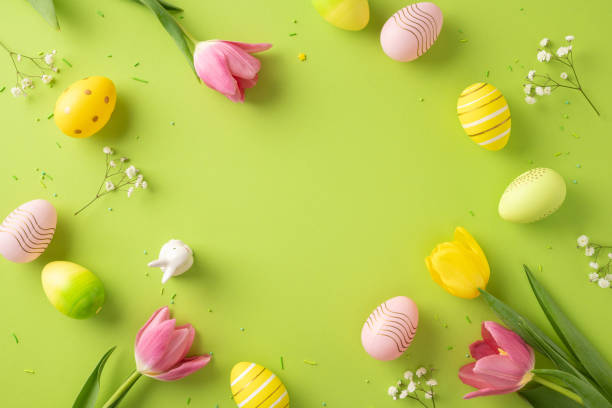 istock Decorative Easter eggs and colorful tulips arranged on a green surface, evoking joy. Perfect for Easter celebrations, creativity inspiration, and spring-themed designs with cheerful and festive vibes 2202118192