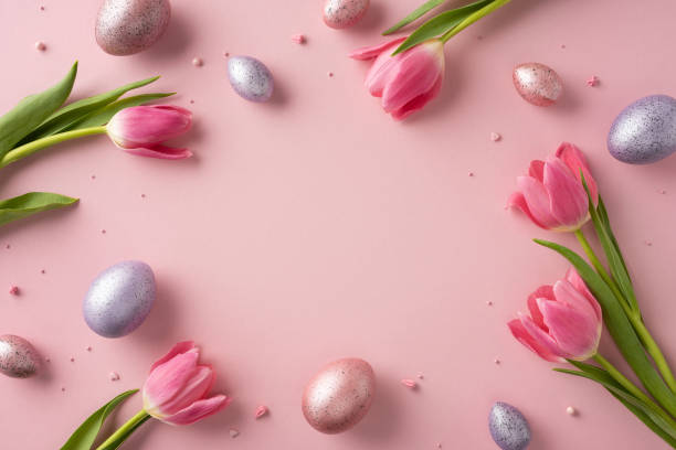istock Pink tulips and decorative eggs scattered on a pastel pink background creating a festive and elegant scene perfect for spring and Easter celebrations 2202118206