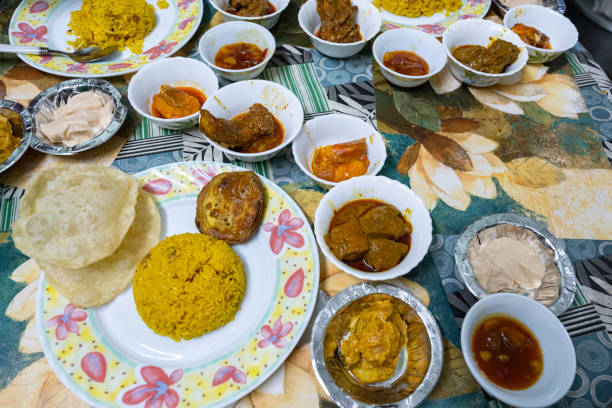 istock Traditional bengali food feast featuring luchi, pulao, and various dishes 2202118358