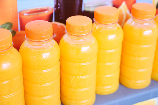 plastic bottle of orange juice in a shelf ,