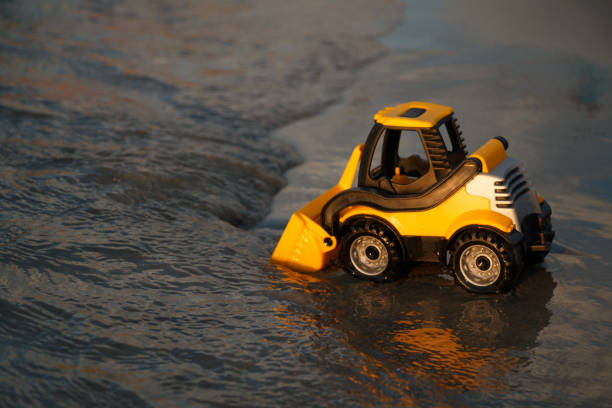 istock toy bulldozer in sand 2202124515