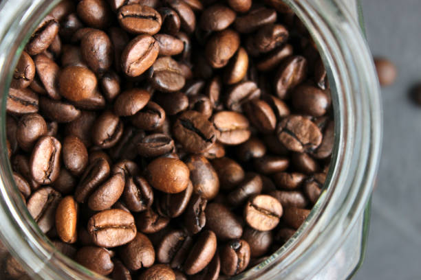 istock Arabica coffee beans in a jar on a table 2202124543