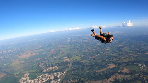 istock A Brazilian skydiver in free fall, on a summer day. Smiling and confident. 2202125838