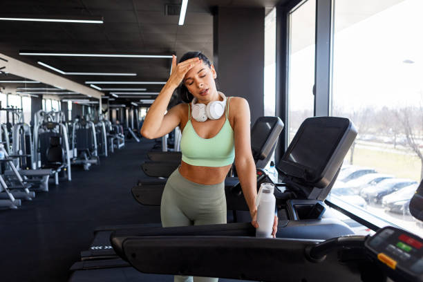 istock Confident Runner with Headphones Exercising in Gym Taking a Break 2202127331