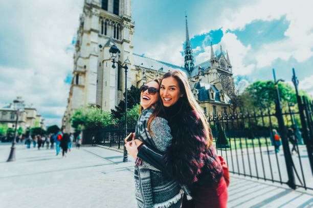 Happy friends enjoying Paris during the spring