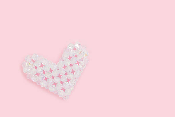 istock White heart figurine made from square acrylic beads. 2202128072