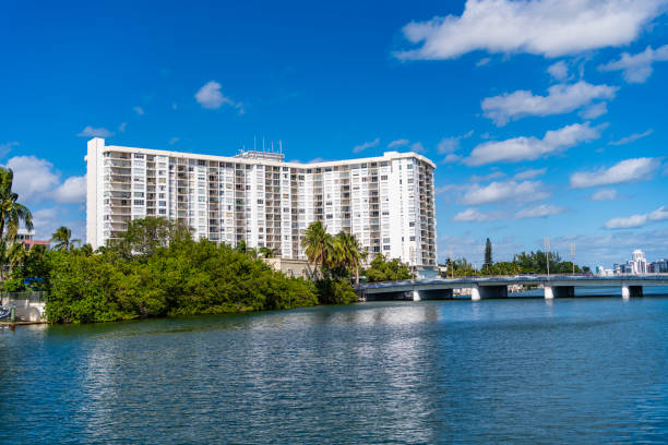 istock Luxury waterfront house. Hotel building architecture at bridge. Residential architecture building. Residential apartment in waterfront city. City waterfront with house. Vacation building in summer 2202128715