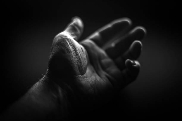 Male hand with ink thumb, after voting.