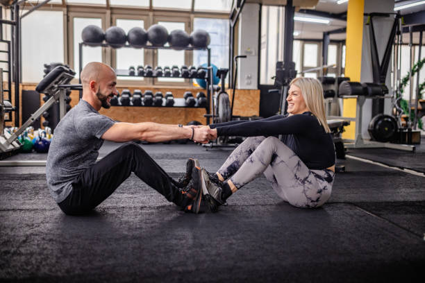 istock Trainers Exercising on the Floor with Team Spirit 2202132997