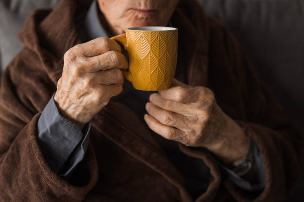 istock Elderly man drinking coffee, close up 2202133817