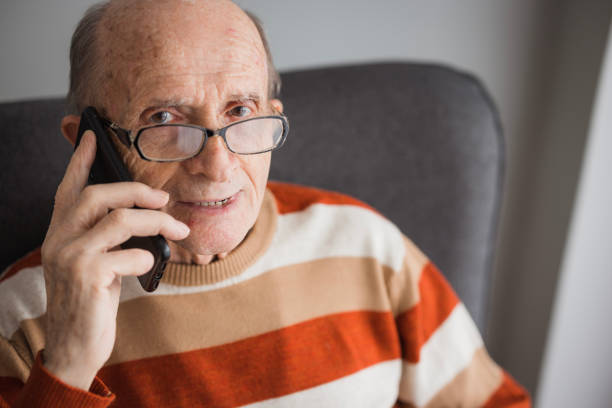 istock Cheerful old man on a phone call 2202133939