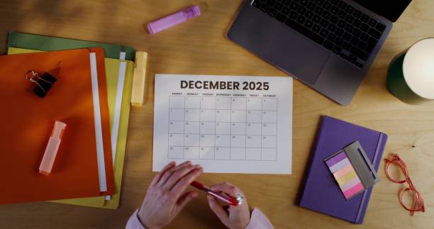 istock Woman's hands mark the date in the calendar 2202134056