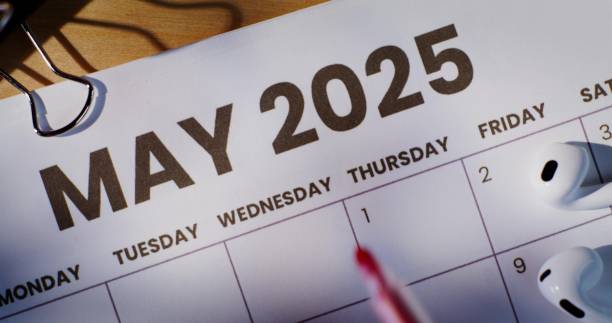 istock A woman circles a date on a calendar 2202134503