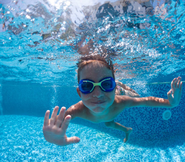 istock Cute little boy swimming underwater. 2202137006