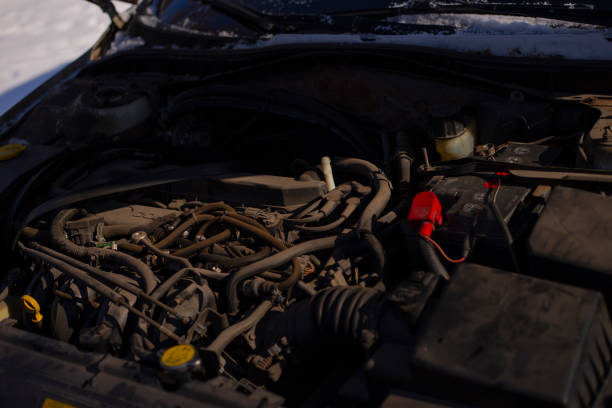 istock car battery under the hood 2202137132