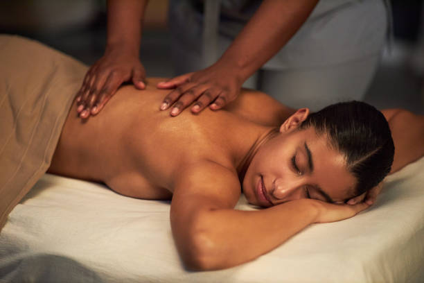 istock Relaxing Massage Session with Female Therapist in Spa Setting 2202137489