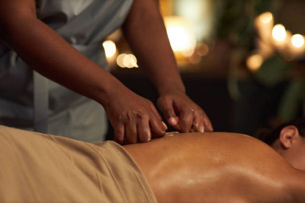 istock Providing Therapeutic Massage in Relaxing Spa Setting 2202137588