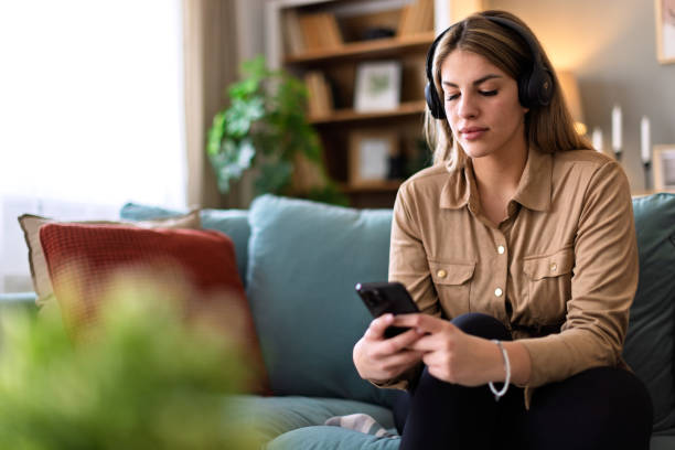 istock Young women playing on a mobile phone 2202137742