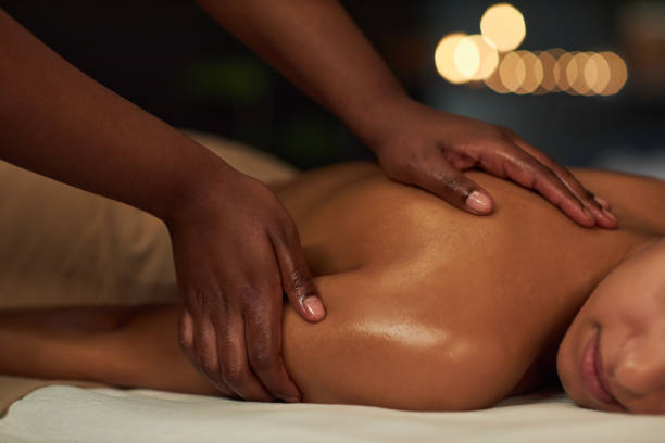 istock Enjoying Therapeutic Body Massage in Relaxing Atmosphere 2202137745