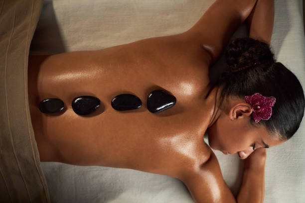 istock Enjoying Relaxation with Hot Stone Massage Therapy 2202137859