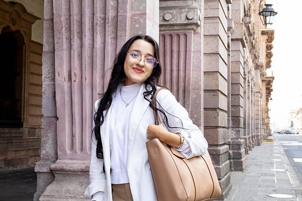 istock Happy young woman looking at the camera 2202137886
