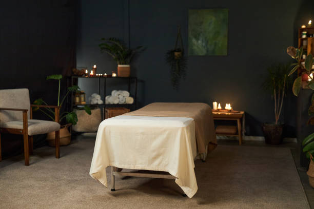 istock Cozy and Inviting Massage Table Setup in Tranquil Room 2202138011
