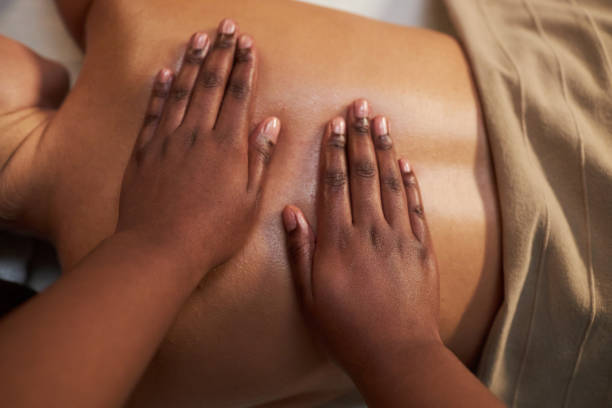 istock Providing Therapeutic Massage on Relaxed Individual 2202138129