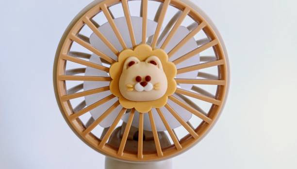 istock Rechargeable handheld fan used for cooling. 2202138750