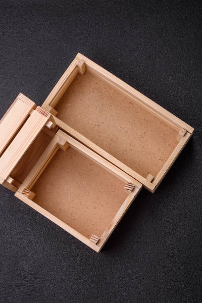 Empty wooden box for fruits or vegetables on dark concrete background