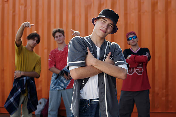 istock Posing with Friends in Front of Orange Wall 2202140742