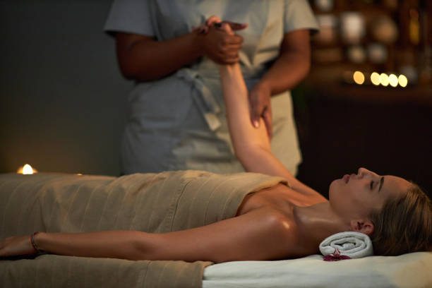 istock Receiving Relaxing Massage in Tranquil Spa Environment 2202140930
