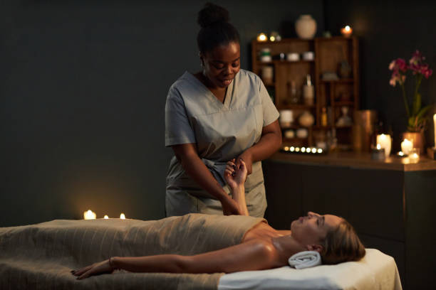 Relaxing Massage Session in Dimly Lit Spa Ambiance