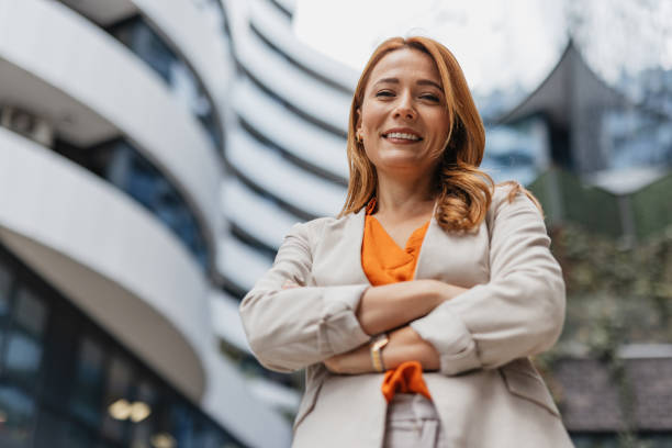 istock Confident woman smiling with arms crossed. 2202141350