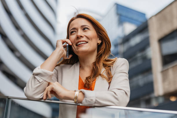 istock Woman Talking on Phone with Big Smile 2202142109