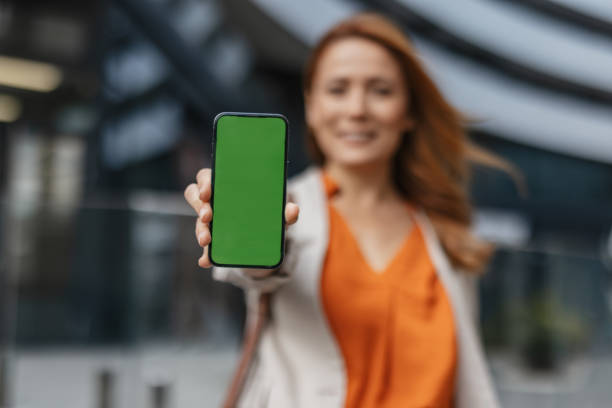 istock Woman Posing with Smartphone in Urban Context 2202142432